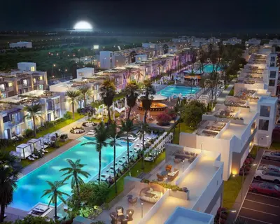an aerial view of a resort at night at Grand Shapphire 4 apartments SEA VIEW in Paralimni