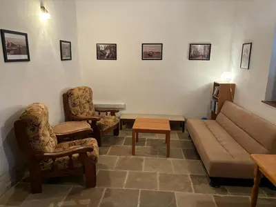 a living room with a couch and two chairs at Calypso Historic Village House in Limassol