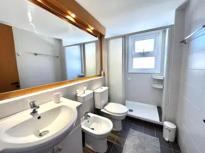 a bathroom with a sink and a toilet and a mirror at STAY Agapi Sea view Villa in Pissouri