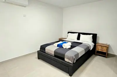 a bedroom with a bed and a night stand at Pareklisia Mystical Haven in Parekklisha