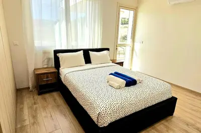 a bedroom with a bed with a pillow on it at Pareklisia Mystical Haven in Parekklisha