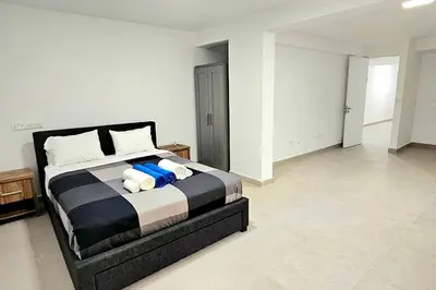 a bedroom with a bed with two pillows at Pareklisia Mystical Haven in Parekklisha