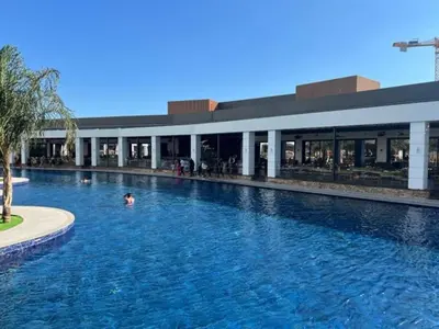 a person swimming in a swimming pool in a building at Grand Sapphire,Luxury Residence BY Report Homes Northern Cyprus in Ayia Napa