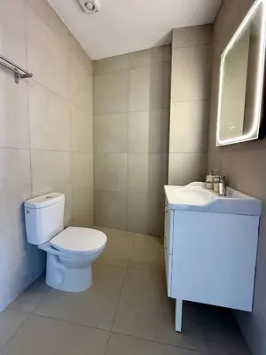 a bathroom with a toilet and a sink at Kiti Traditional Residences in Larnaka
