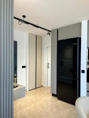 a living room with a large black refrigerator at Sweet Luxury 2BR Nicosia City in Nicosia