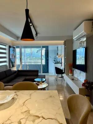 a living room with a couch and a table at Sweet Luxury 2BR Nicosia City in Nicosia