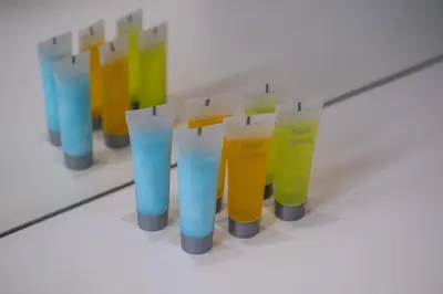 a row of different colored plastic cups in a row at Parkside 2 Bedroom Apartment in Larnaka