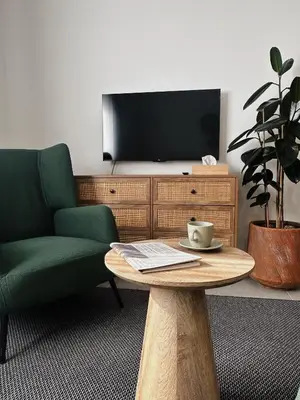 a living room with a coffee table and a tv at Grace Living in Limassol