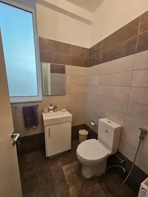 a bathroom with a toilet and a sink at 3 bedroom villa in Voroklini