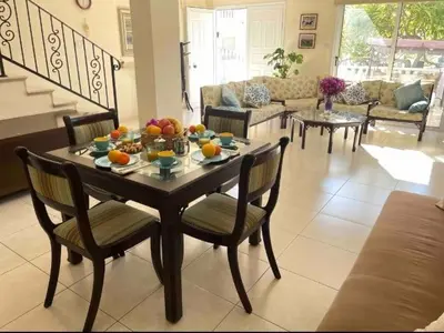 a table with fruit on it in a living room at Villa Flamingo ,private pool & Sea view in Ayia Napa