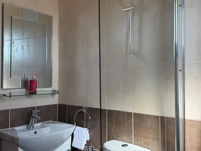 a bathroom with a shower and a sink and a toilet at NEW - Agia Marina - Rural Retreat with Shared Pool & Parking in Avgorou