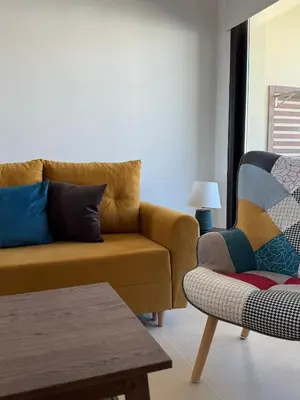 a living room with a couch and a chair at NEW - Agia Marina - Rural Retreat with Shared Pool & Parking in Avgorou