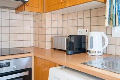 a kitchen with a counter top with a microwave at Spacious City Centre Living in Nicosia