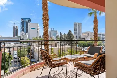 a balcony with chairs and a view of the city at Spacious City Centre Living in Nicosia