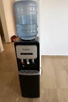 a bottle of water on top of a water cooler at Villa Keskin - Girne in Ayios Ioannis