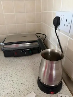 a pot sitting on top of a stove in a kitchen at Villa Keskin - Girne in Ayios Ioannis