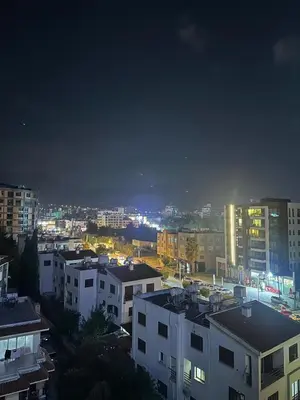 a view of a city at night with buildings at Moonlight Home in Nicosia