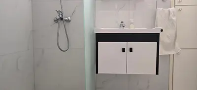 a white bathroom with a sink and a shower at Executive 2BR Spacious Apartment , Limassol Center, 2 Balconies, Ideal Business Stay - SuperCentro! in Limassol