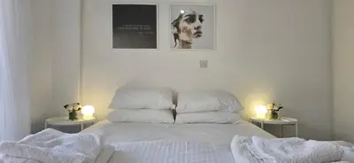 a bedroom with a bed with towels on it at Executive 2BR Spacious Apartment , Limassol Center, 2 Balconies, Ideal Business Stay - SuperCentro! in Limassol