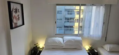 a bedroom with a white bed and a window at Executive 2BR Spacious Apartment , Limassol Center, 2 Balconies, Ideal Business Stay - SuperCentro! in Limassol