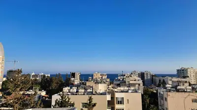 a city with buildings and the ocean in the background at City center beach and supermarket walking distance in Limassol