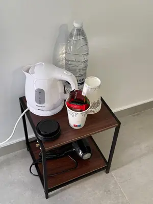 a table with a mixer and a bottle of water at GREEN Cabin-Larnaca Centrum in Larnaka
