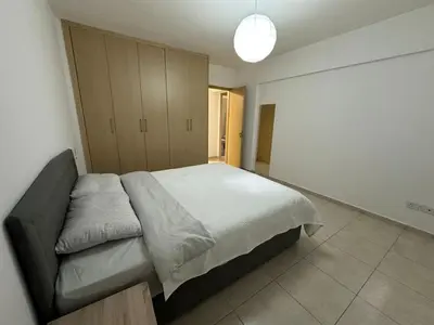a bedroom with a large bed in a room at 2 Bedroom Penthouse Apartment With Swimming Pool in Kiti