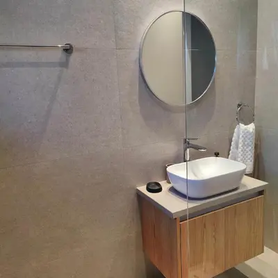 a bathroom with a sink and a mirror at Ruach Villa in Paralimni