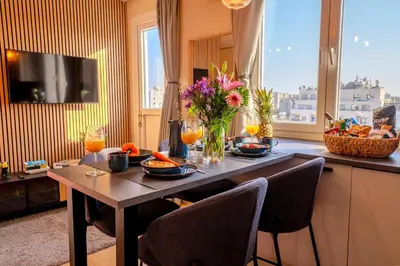 a table with food and drinks on it in a kitchen at New Central 2 bedroom Apartment in Limassol