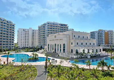 a building with two pools in front of buildings at Modern Smart-Home Studio Pools Gym Terrace View in Paralimni
