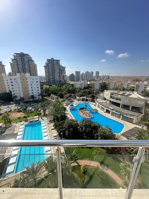 a view of the pool from the balcony of a apartment at Long Beach İskele - Caesar Resort Studio , Near Famagusta in Paralimni