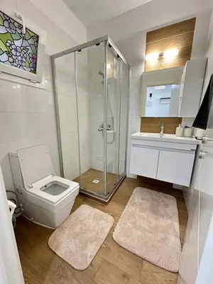 a bathroom with a shower and a toilet and a sink at Long Beach İskele - Caesar Resort Studio , Near Famagusta in Paralimni