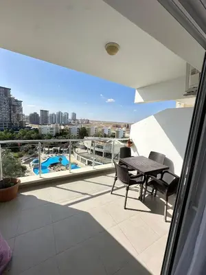 a balcony with a table and chairs and a view at Long Beach İskele - Caesar Resort Studio , Near Famagusta in Paralimni