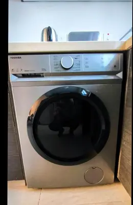 a microwave oven with its door open in a kitchen at Harmonia Home in Paralimni