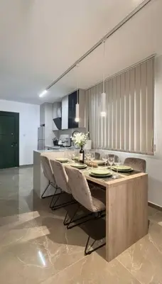a dining room with a table and chairs at Luxury Beach Villa 2 min Walk to Sea & Airport in Meneou