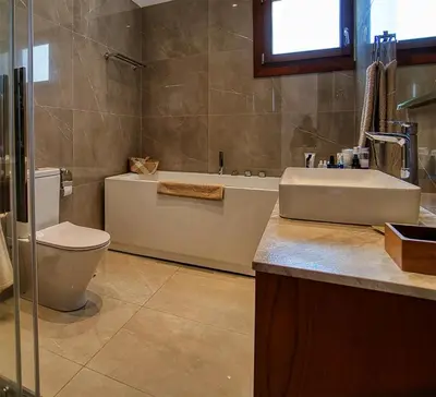 a bathroom with a sink and a toilet and a tub at Cyprus Sunbay Retreat in Ayia Napa