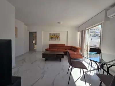 a living room with a couch and a glass table at City Heart Residence by Staycom in Nicosia