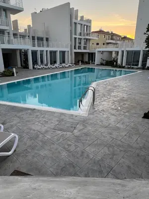 a swimming pool in the middle of a building at Modern Marvel Seaview in Paralimni