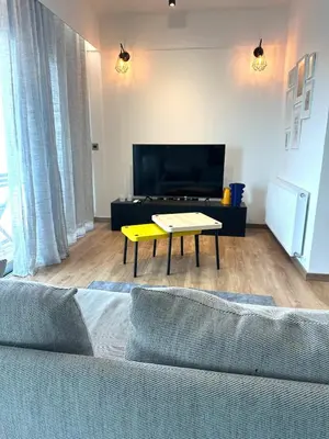 a living room with a couch and a coffee table at Zeus Downtown Hub with Panoramic View in Nicosia