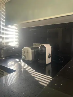 a kitchen with two toasters on a counter at Famagusta Guest House in Mağusa