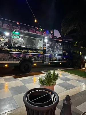 a food truck parked on the street at night at Kıbrıs Girnede 1 yatak odalı Süper lüks havuzlu daire in Vuda