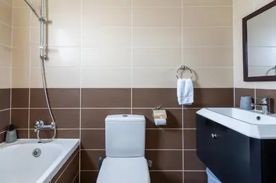 a bathroom with a toilet and a sink at Sonic 2-Bedroom Apartment in Larnaka