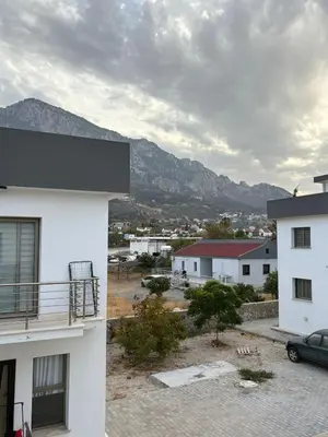 a view from a building with mountains in the background at Lapta Yellow 1 bedroom in Limassol