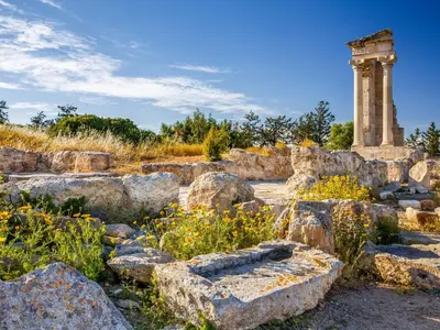 a monument in a field with rocks and flowers at Sanders Soul Apartments - Full Building in Limassol