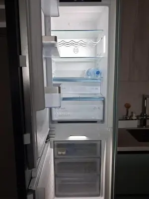 an empty refrigerator with its door open in a kitchen at Lazuli Sea View & Pool Ap 502 in Larnaka