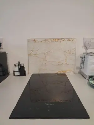 a black rug on a counter in a kitchen at Lazuli City Center Studio 161 - 100 m from the beach in Larnaka