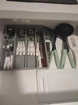 a drawer full of kitchen utensils in a cabinet at Lazuli City Center Studio 161 - 100 m from the beach in Larnaka