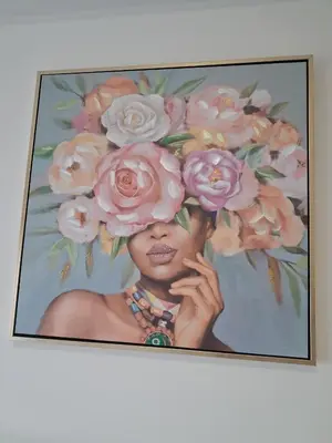 a painting of a woman with flowers on her head at Lazuli City Center Studio 161 - 100 m from the beach in Larnaka