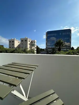 a group of chairs sitting on top of a building at Seaside Studio in Limassol