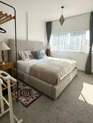 a bedroom with a bed and a window at Nicosia city center 1BDR apartment in Nicosia